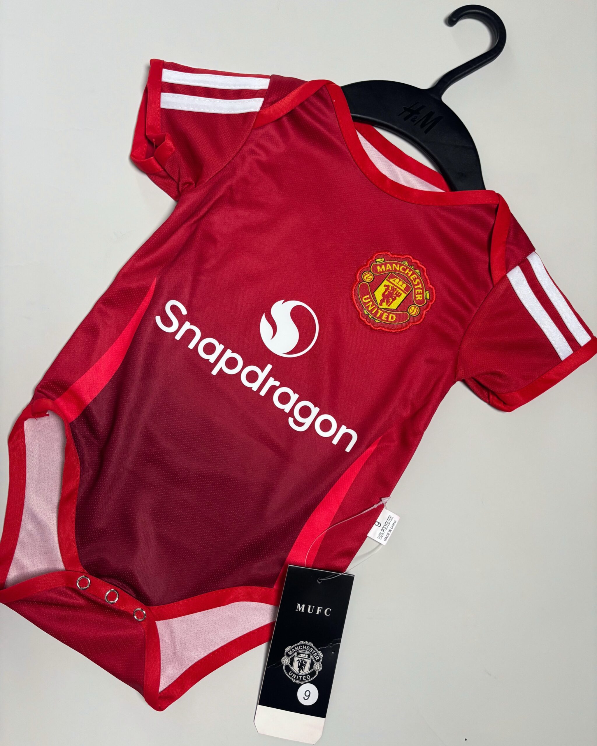 9ef980d1-f418-4fb4-91e1-06db380fe873 Baby Manchester United Home Kit - 24/25 - Image 1